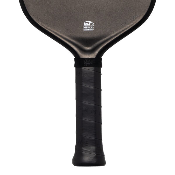 Close-up of the paddle throat and handle showing a USA Pickleball Approved logo and the word "GAME" debossed on the black handle grip.
