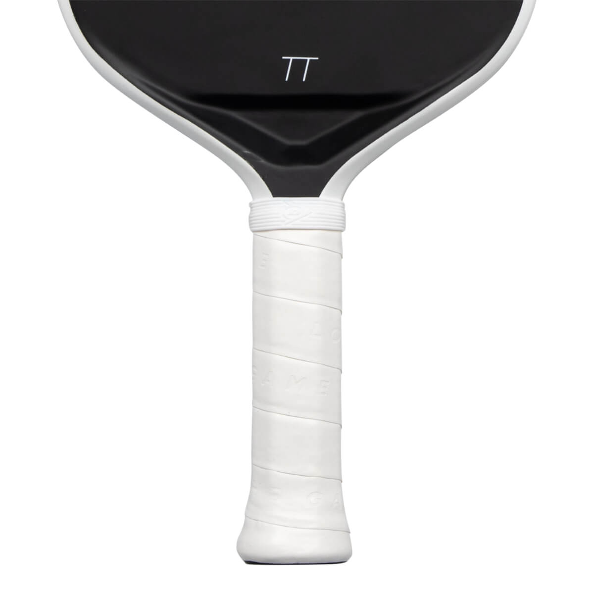 Close-up view of a paddle showing its white wrapped handle and the lower portion of its black face featuring a white TT logo.
