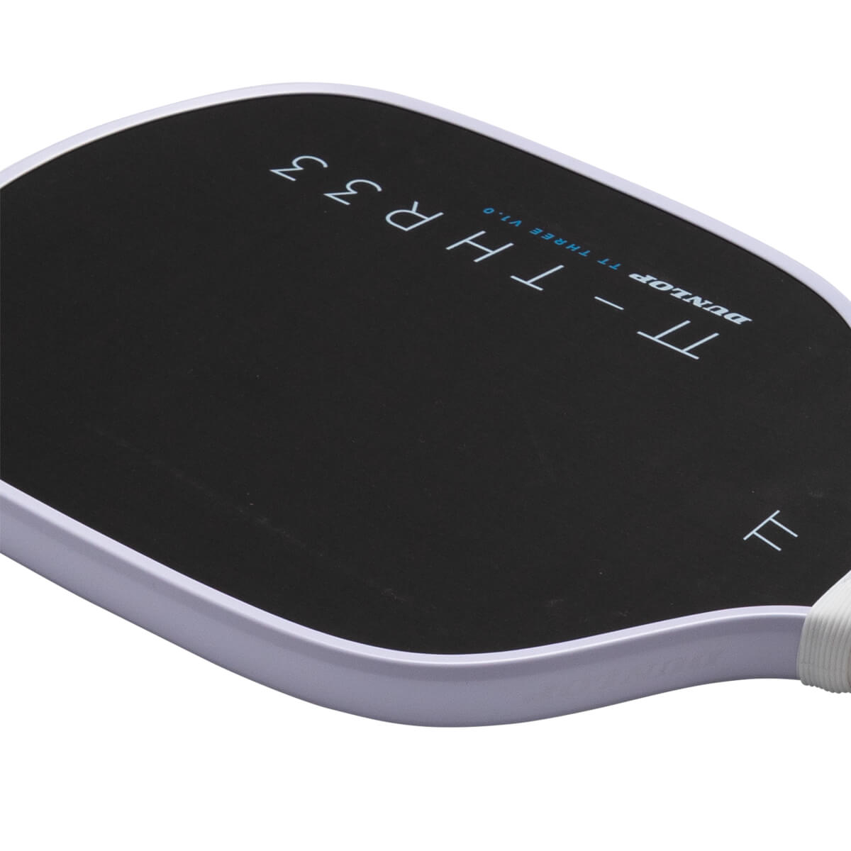 Close-up view of the black paddle face showing "TT - THR33" and "DUNLOP" text with a light purple edge guard.