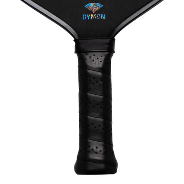 Close-up of the Dymon Mayhem paddle's black grip and the "DYMON" logo with a diamond design.