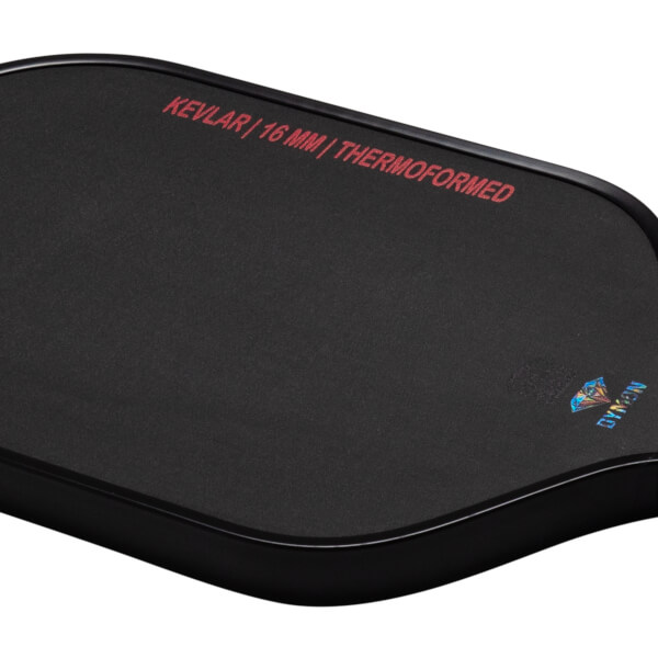 Top-down view of a black pad with red text "KEVLAR | 16 MM | THERMOFORMED" and a diamond logo with "DYMON" text.