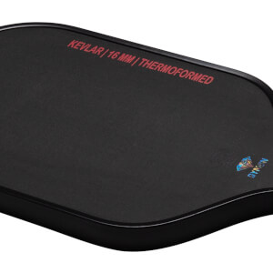 Top-down view of a black pad with red text "KEVLAR | 16 MM | THERMOFORMED" and a diamond logo with "DYMON" text.