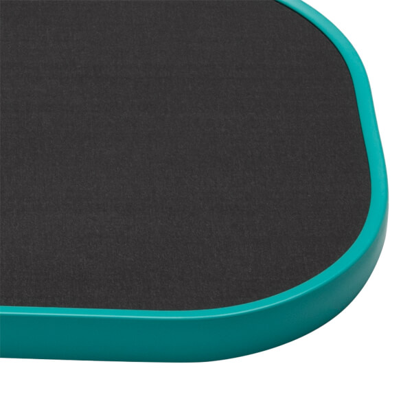Close-up corner view showing the black textured carbon fiber face and a rounded teal edge guard.