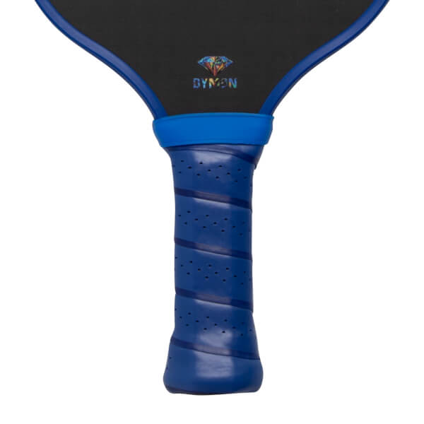 Close-up of the blue perforated handle and black paddle face featuring a colorful diamond logo and the word DYMON.