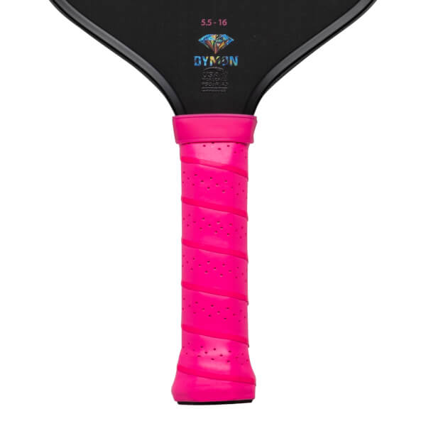 Close-up of a black pickleball paddle with a bright pink grip, showing the "DYMON" logo and "5.5-16" text.
