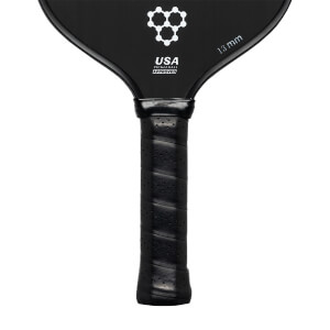 Top-down view of a black pickleball paddle with a honeycomb logo, USA PICKLEBALL APPROVED text, and 13 mm marking.