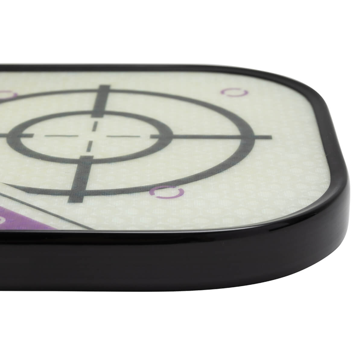 Corner view of a white pickleball paddle with a black edge and target design.