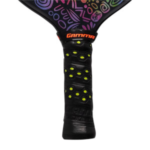 Close-up of a black pickleball paddle grip with yellow honeycomb pattern and GAMMA logo.