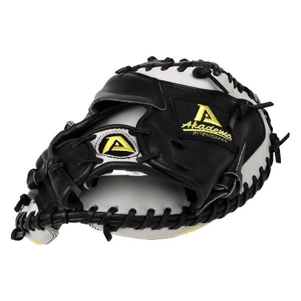 Front view of a black and white catchers mitt with yellow Akadema branding and a large A logo.