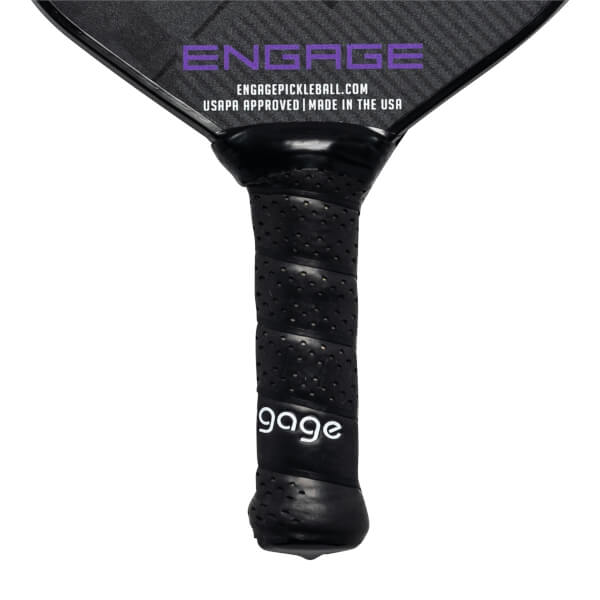 Close-up of a black pickleball paddle grip with perforated texture and gage logo.