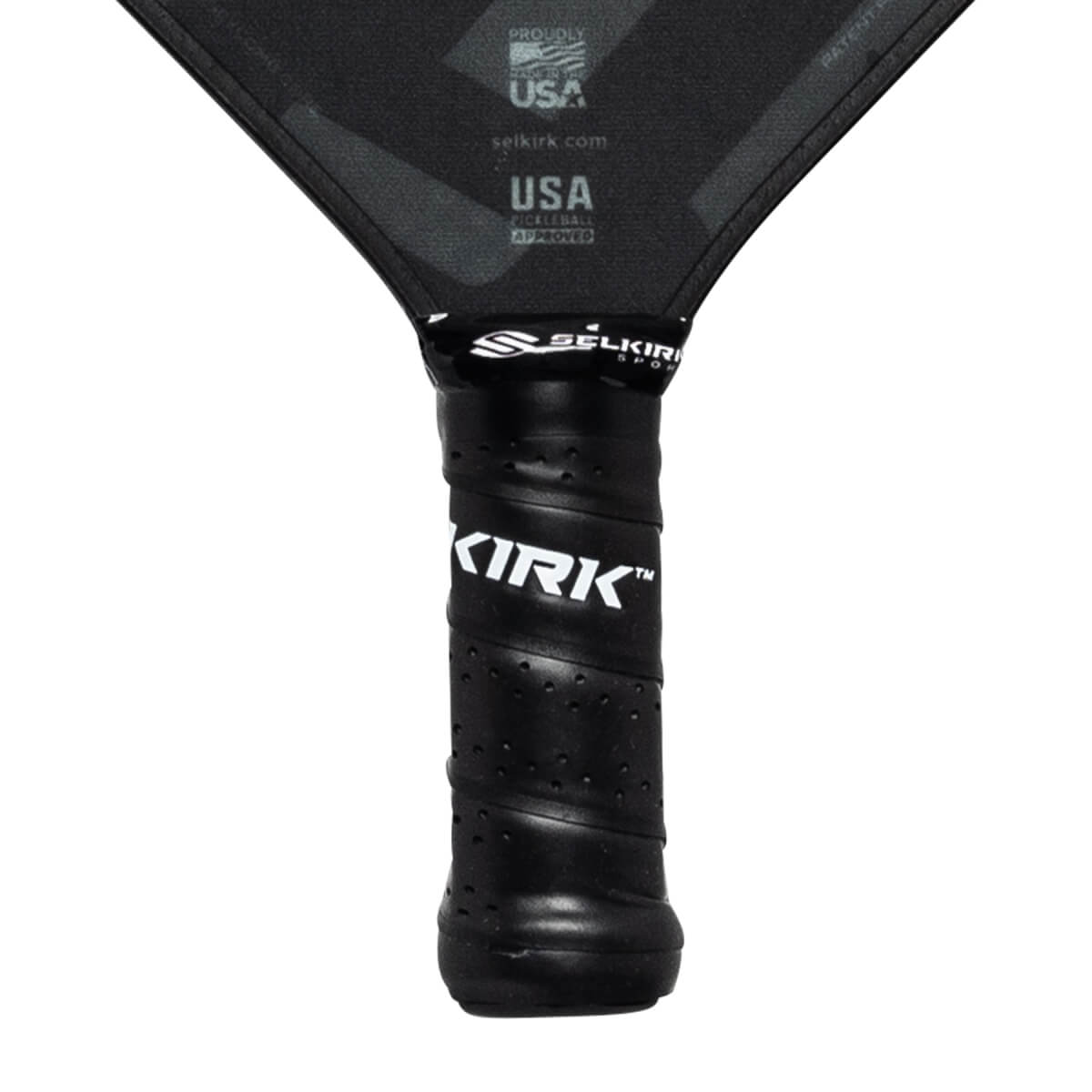 Close-up of a black pickleball paddle grip with KIRK branding and SELKIRK logo.
