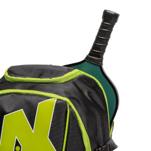 Close-up of a black pickleball backpack with green trim and a black pickleball paddle handle.