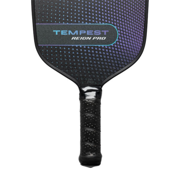 Top-down view of a black pickleball paddle with TEMPEST REIGN PRO text and a gradient purple dotted pattern.