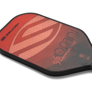 Corner view of a red and black pickleball paddle with Selkirk and Omni branding.