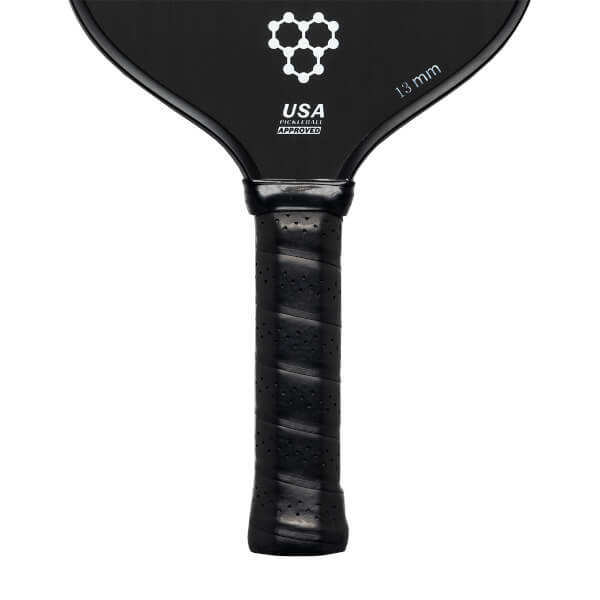 Top-down view of a black pickleball paddle with a honeycomb logo, USA PICKLEBALL APPROVED text, and 13 mm marking.