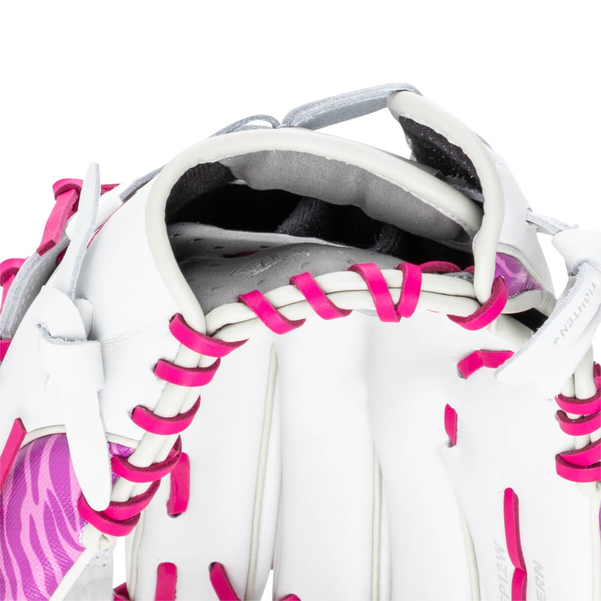 Close-up of a white and pink softball glove showing bright pink lacing and a zebra stripe pattern.