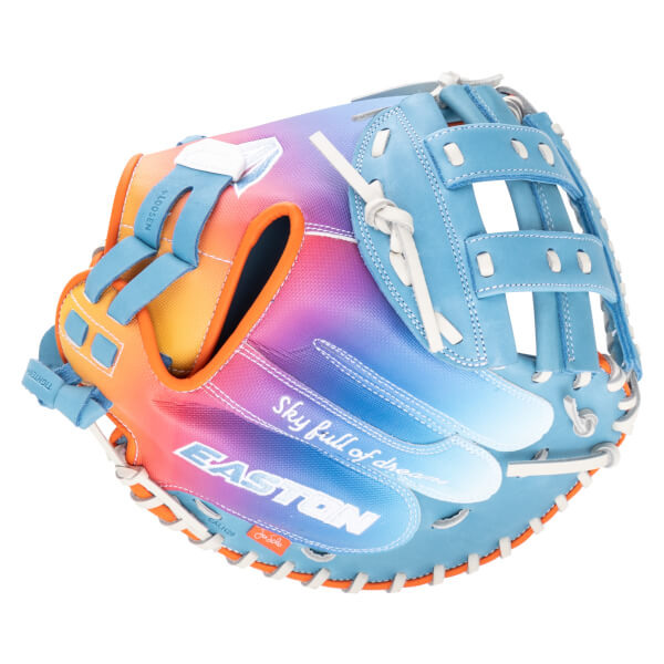 Top-down view of a blue Easton baseball glove with a rainbow gradient and "Sky full of dreams" text.