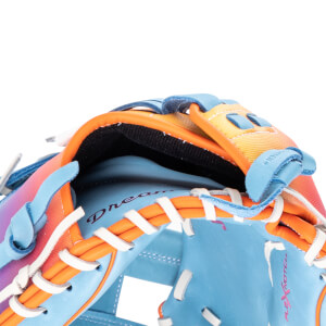 Close-up of a blue baseball glove showing orange lacing, white stitching, and the word "Dream" in cursive.