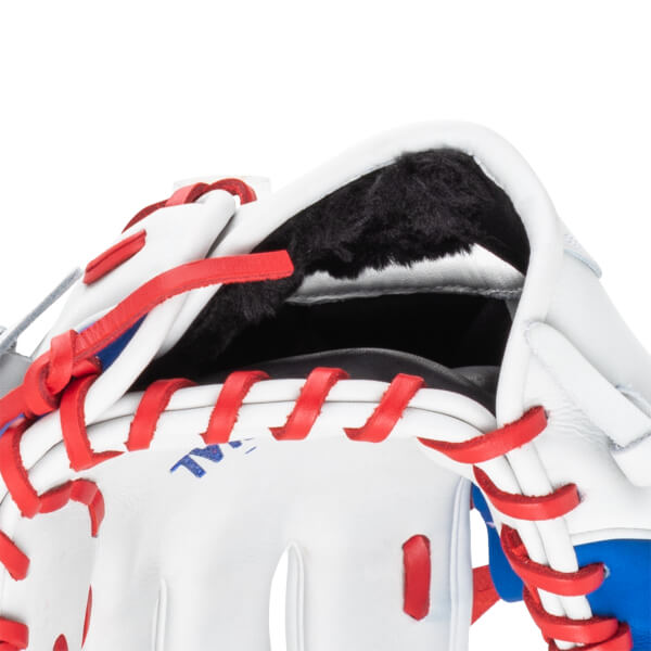 Close-up of a white baseball glove with red lacing and black fur lining.