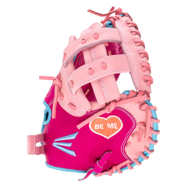 Front view of a pink and blue baseball glove with "BE ME" inside a heart.