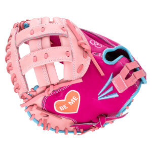 Side view of a pink and blue baseball glove with an orange heart patch that says "BE ME".