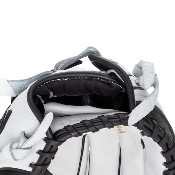 Close-up of the hand opening featuring a black padded lining, white leather shell, and black rawhide lacing with "The Best" embossed inside.