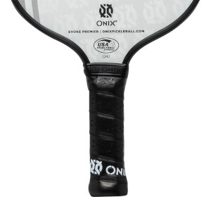 Close-up of a black pickleball paddle grip with perforated texture and ONIX branding.