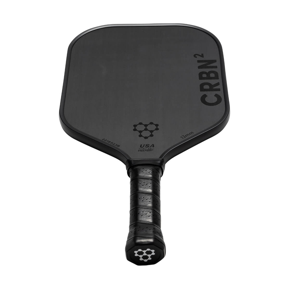 Top-down view of a black pickleball paddle with CRBN² branding, a honeycomb logo, and USA Pickleball text.