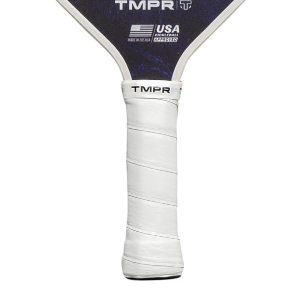 Close-up of a white pickleball paddle grip with TMPR branding and a USA Pickleball Approved logo.