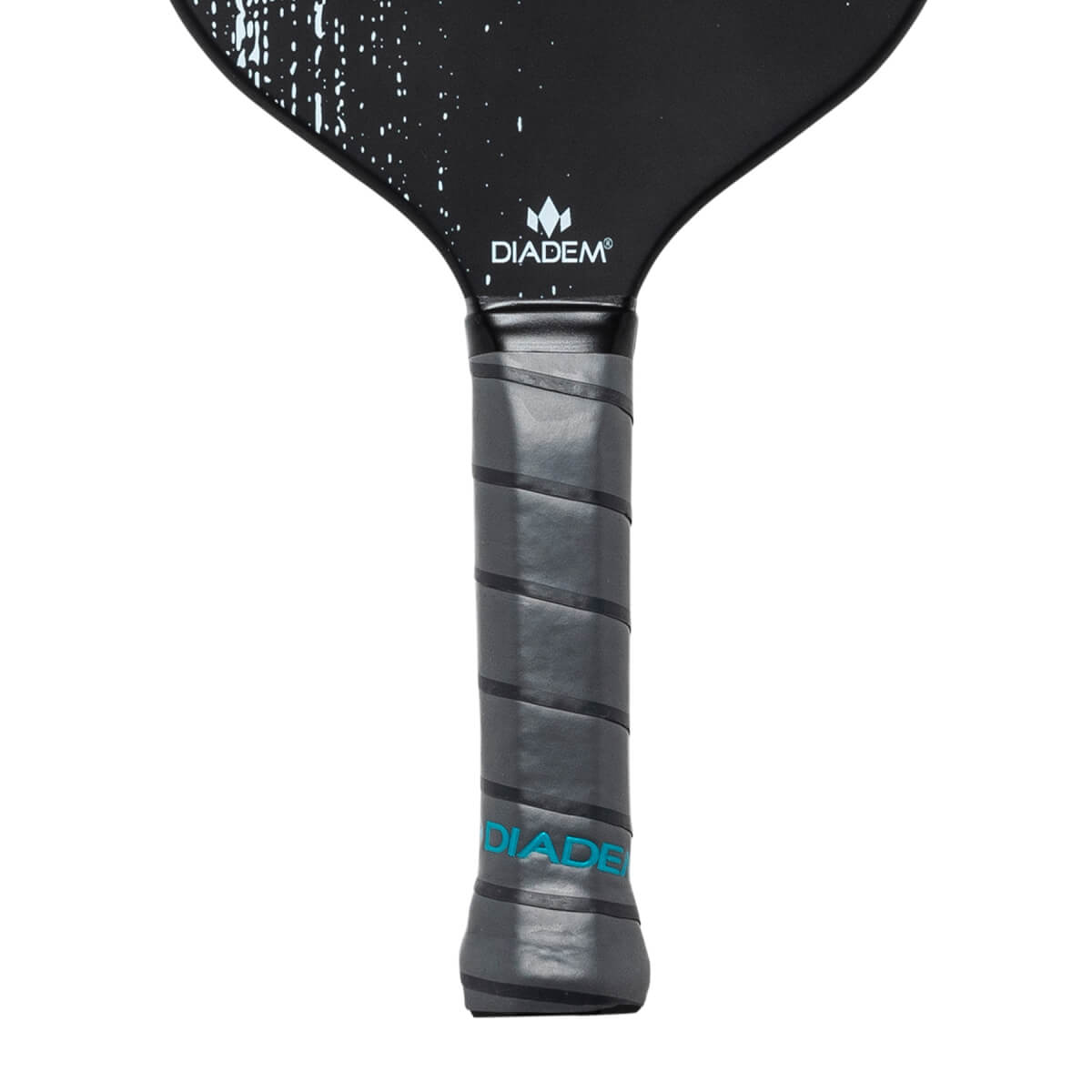 Close-up of a black pickleball paddle grip with gray spiral tape and DIADEM text.