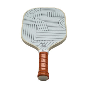 Front view of a light blue pickleball paddle with a geometric line design, HOLBROOK text, and a brown grip.