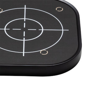 Close-up of a black target with white crosshairs and concentric circles, and two small gold arcs.