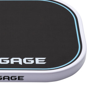 Corner close-up of a black pickleball paddle with a white edge guard and light blue border, displaying the word GAGE on both the face and the side.