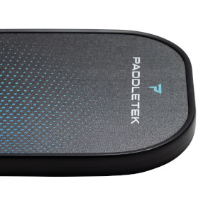 Corner view of a black pickleball paddle with blue dot pattern and Paddletek logo.