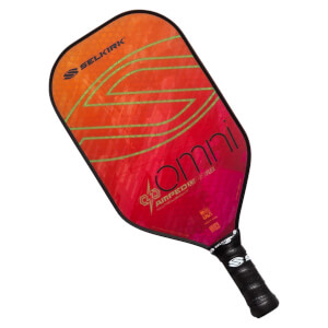 Top-down view of a red and orange pickleball paddle with green lines, OMNI text, and a black grip.