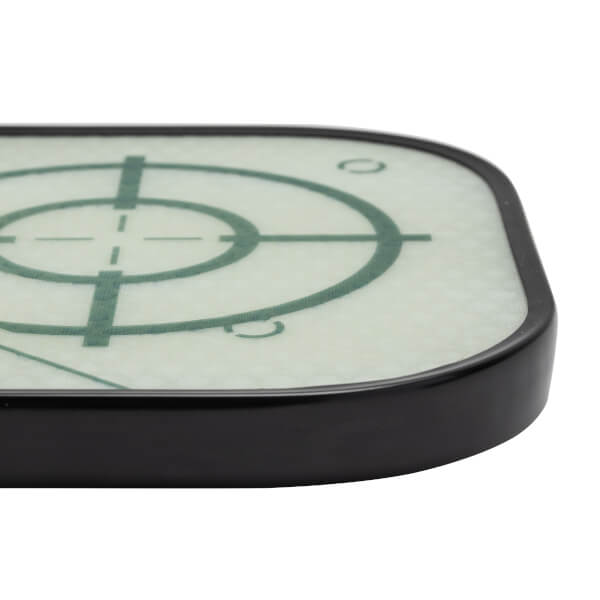 Close-up of a black pickleball paddle with a green target design and textured surface.