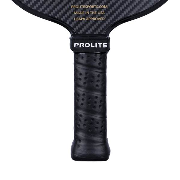 Top-down view of a black pickleball paddle with a carbon fiber face, PROLITE logo, and perforated grip.
