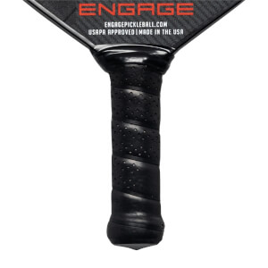 Close-up of a black pickleball paddle grip with spiral texture and perforations, showing Engage branding and USAPA approved text.