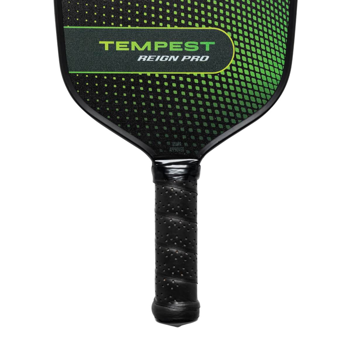 Top-down view of a black pickleball paddle with green TEMPEST REIGN PRO text and a textured grip.