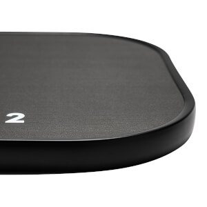 Corner view of a black pickleball paddle with a textured surface and a white number 2.