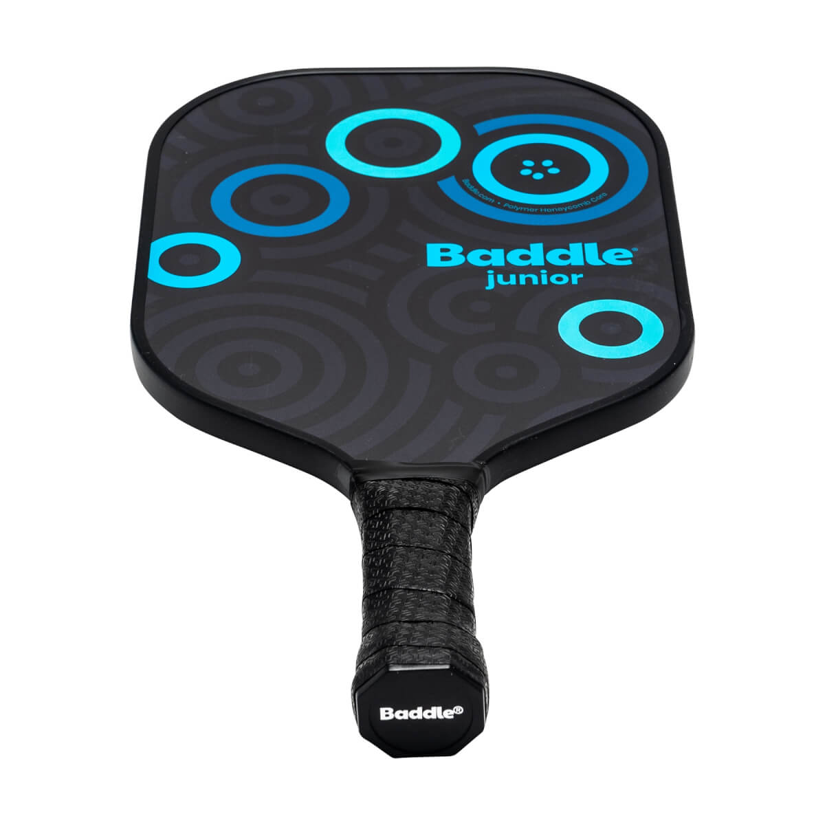 Front view of a black Baddle Junior pickleball paddle with blue concentric circles and textured grip.