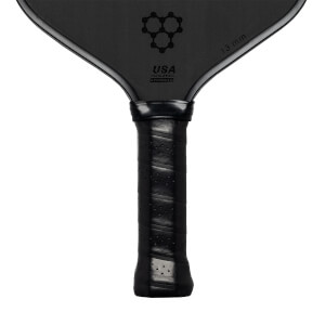 Top-down view of a black pickleball paddle with a honeycomb logo, USA PICKLEBALL APPROVED text, and 13 mm marking.