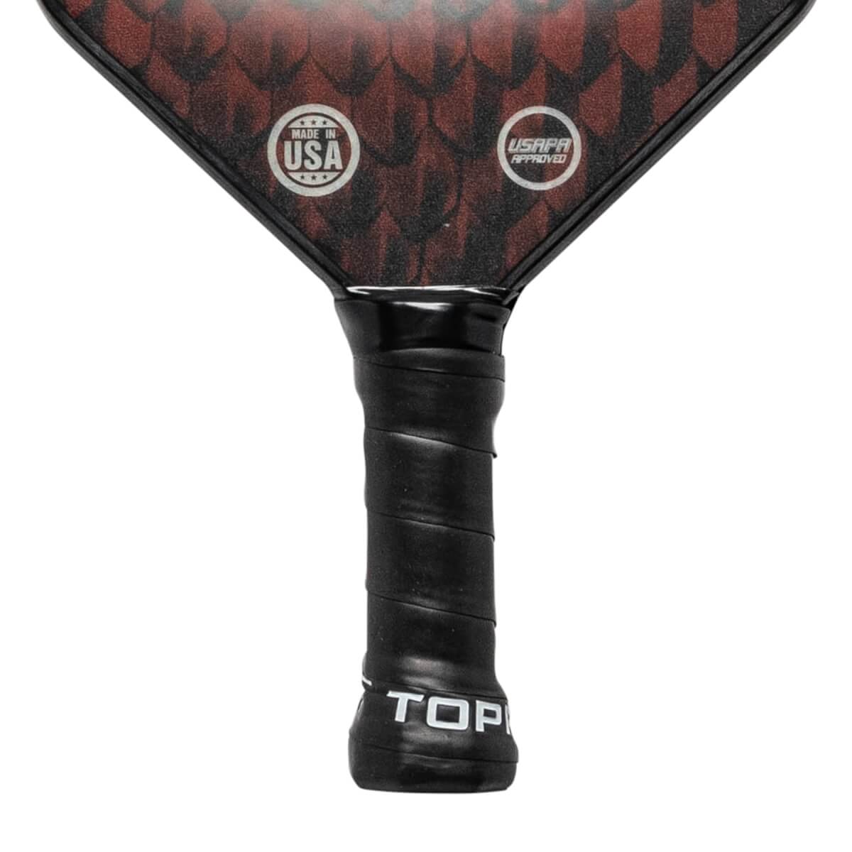 Top-down view of a black pickleball paddle with red scale pattern, MADE IN USA and USAPA APPROVED logos.