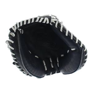 Top-down view of a dark blue baseball glove with white stitching and a textured palm.