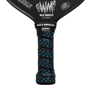 Close-up of a black pickleball paddle grip with blue diamond pattern and WILD MONKEYS text.