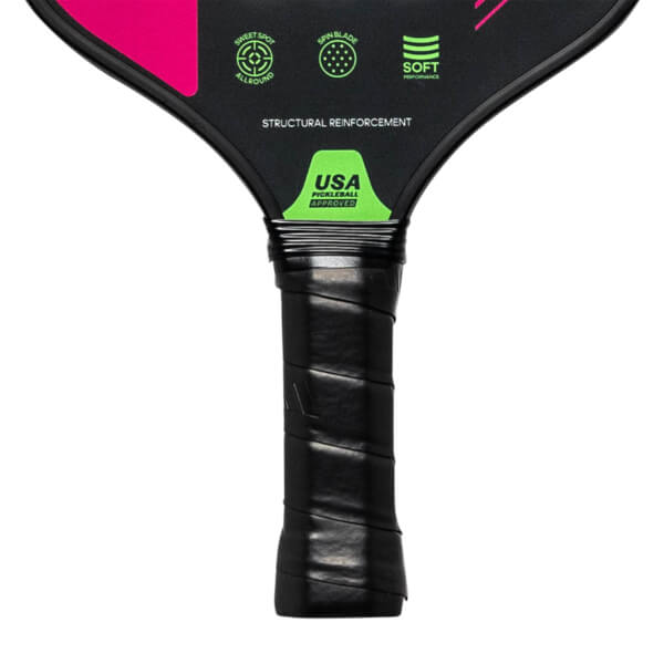 Close-up of a black pickleball paddle grip with USA Pickleball Approved logo and STRUCTURAL REINFORCEMENT text.