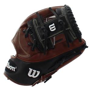 Corner view of a brown and black baseball glove with white stitching and a Wilson logo.