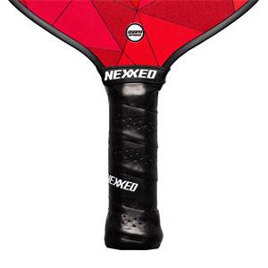 Close-up of a red pickleball paddle with a black grip and NEXXED branding.