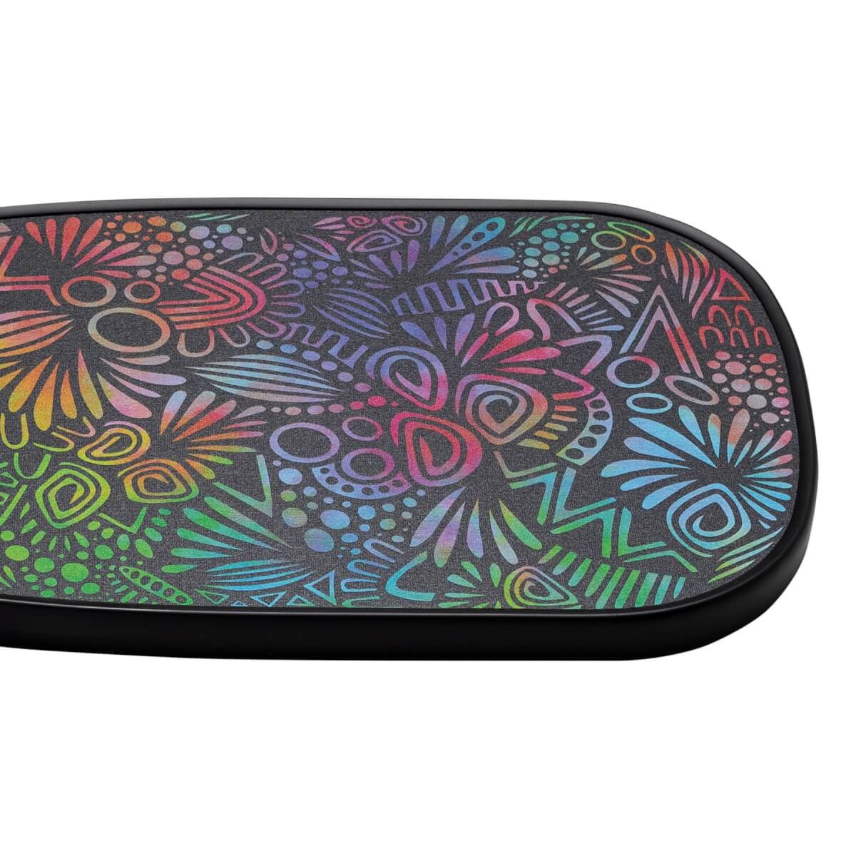 Close-up of a black pickleball paddle with a colorful abstract pattern and textured surface.