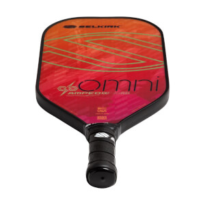 Top-down view of a red pickleball paddle with Selkirk and Omni branding and a black grip.